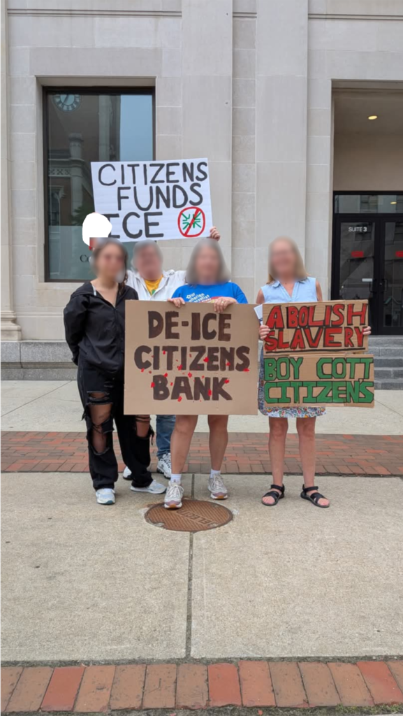 Three individuals holding signs. The signs are calling for removing ICE from Citizen's Bank funding